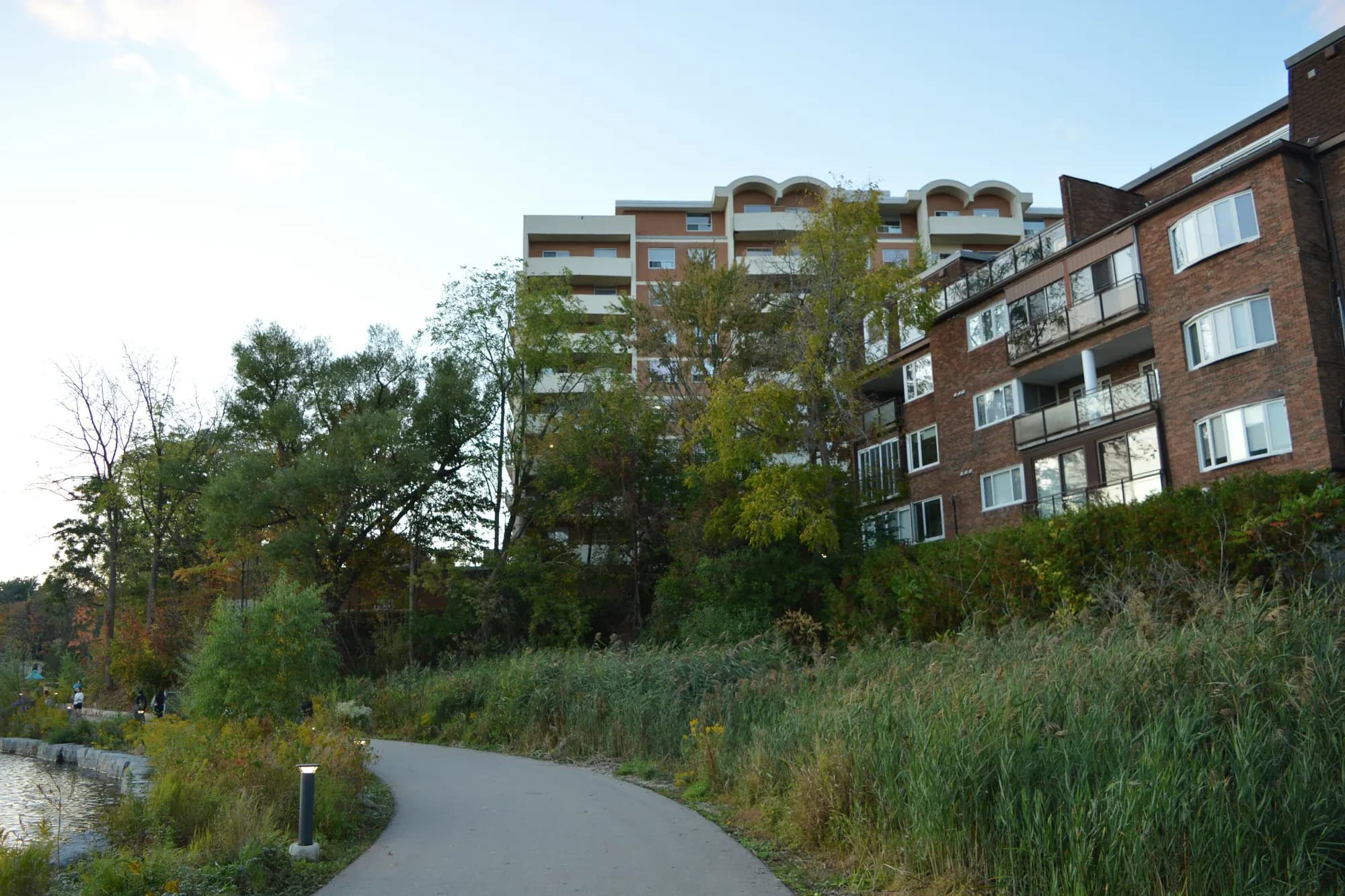 Apartment buildings beside a trail in Waterloo Park, Waterloo, Ontario