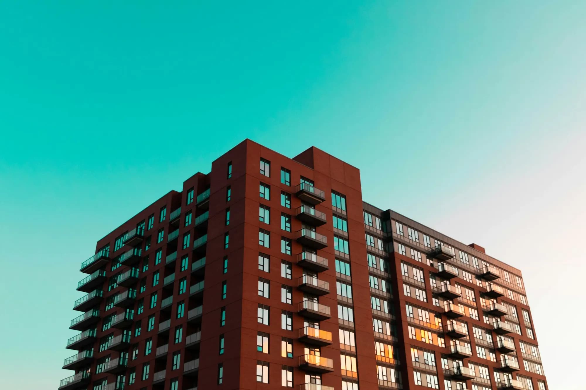 A brick apartment building with balconies in Scarborough, Ontario